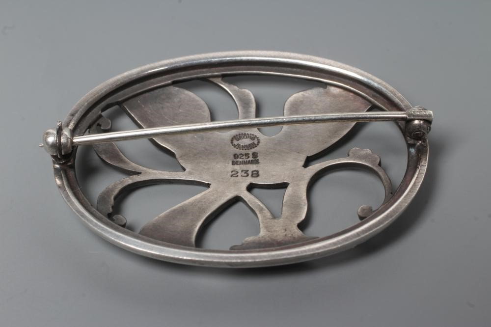 A GEORG JENSEN SILVER OVAL BROOCH designed by Arno Malinowski, cast as a crane in flight, stamped Image
