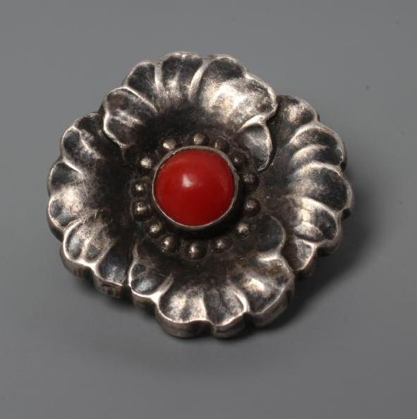 A GEORG JENSEN HOLLOW SILVER FLOWERHEAD BROOCH with polished red hardstone centre, stamped and Image