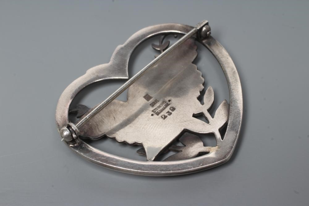 A GEORG JENSEN SILVER HEART SHAPED BROOCH designed by Arno Malinowski with a dove and olive branch, Image