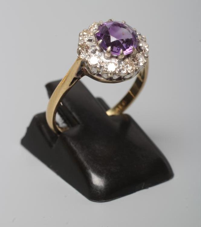 AN AMETHYST AND DIAMOND CLUSTER RING Image