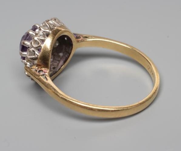 AN AMETHYST AND DIAMOND CLUSTER RING Image