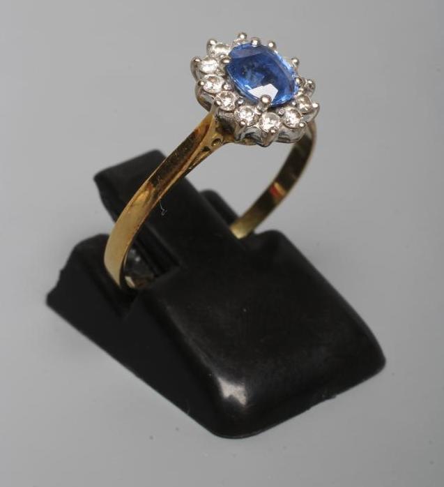 A SAPPHIRE AND DIAMOND CLUSTER RING Image