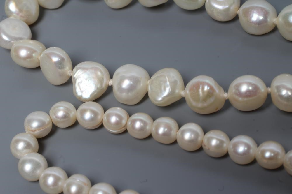Three various cultured pearl necklaces all with silver clasps (est