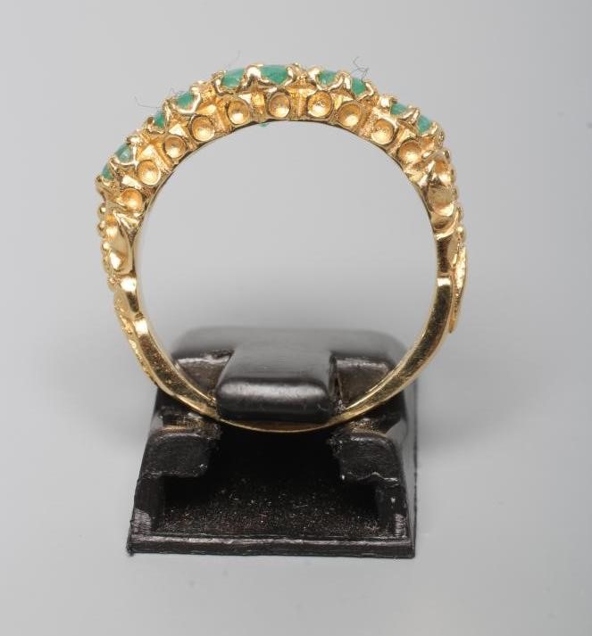 A FIVE STONE EMERALD RING Image