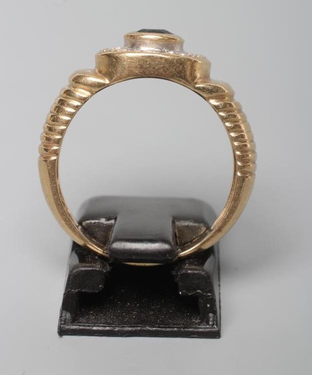 A GENTLEMAN'S SAPPHIRE AND DIAMOND CLUSTER RING Image