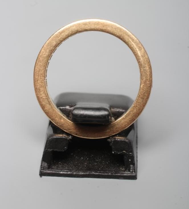 A RUBY HALF HOOP ETERNITY RING, the eighteen square cut stones channel set to a plain shank stamped Image