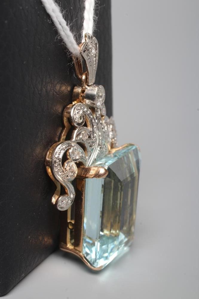 AN AQUAMARINE AND DIAMOND PENDANT Image