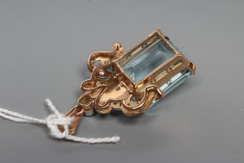 AN AQUAMARINE AND DIAMOND PENDANT Image
