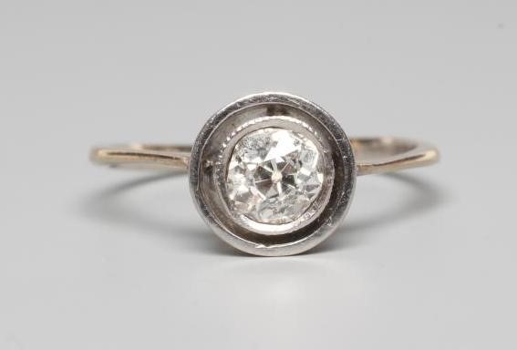 A SOLITAIRE DIAMOND RING, the round brilliant cut stone of approximtely 0.5cts, collet set to a Image