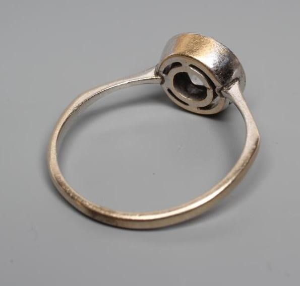 A SOLITAIRE DIAMOND RING, the round brilliant cut stone of approximtely 0.5cts, collet set to a Image