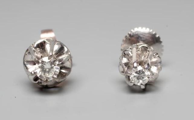 A PAIR OF SOLITAIRE DIAMOND EAR STUDS Image
