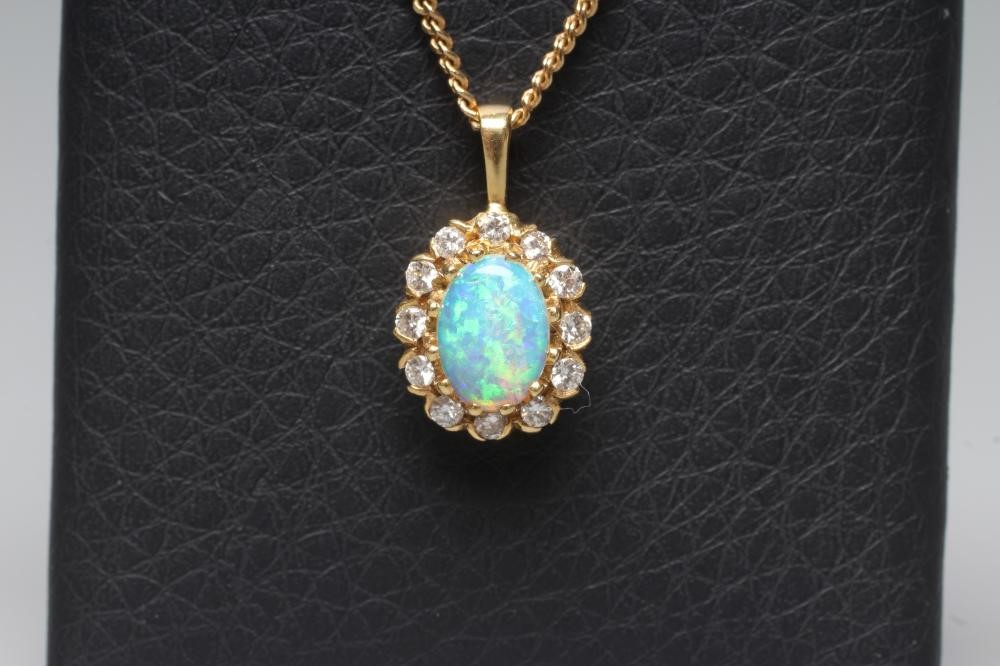 AN OPAL AND DIAMOND CLUSTER PENDANT Image