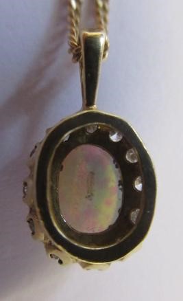 AN OPAL AND DIAMOND CLUSTER PENDANT Image