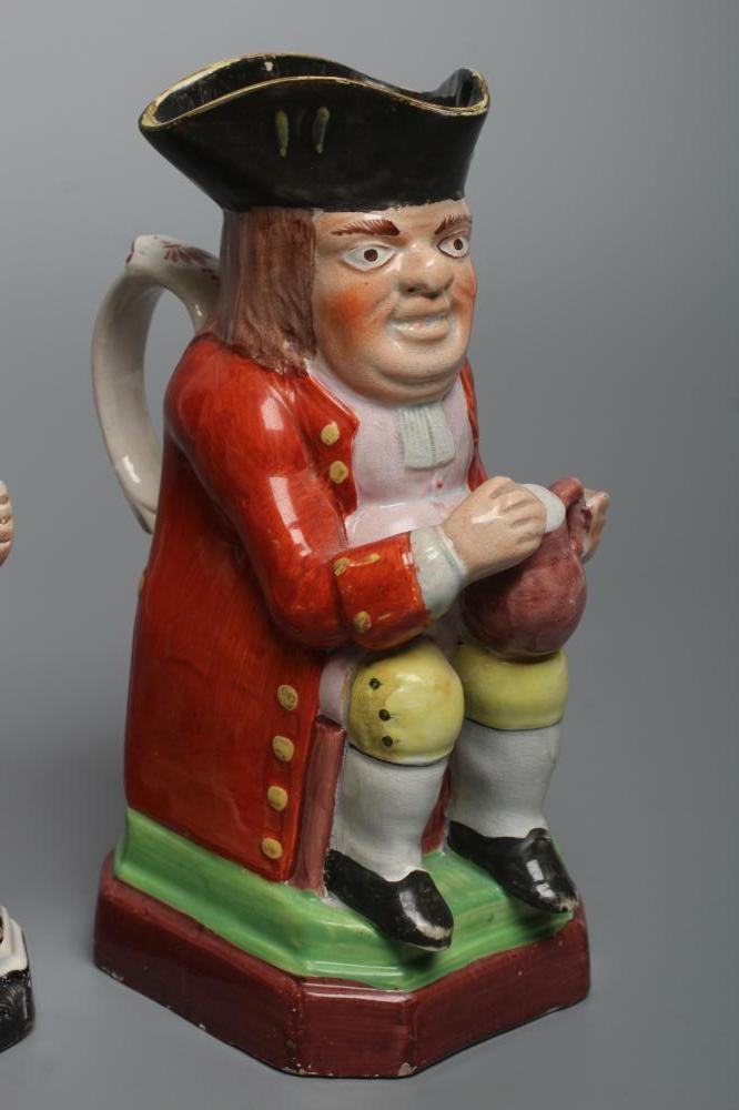 A PEARLWARE SMALL TOBY JUG Image