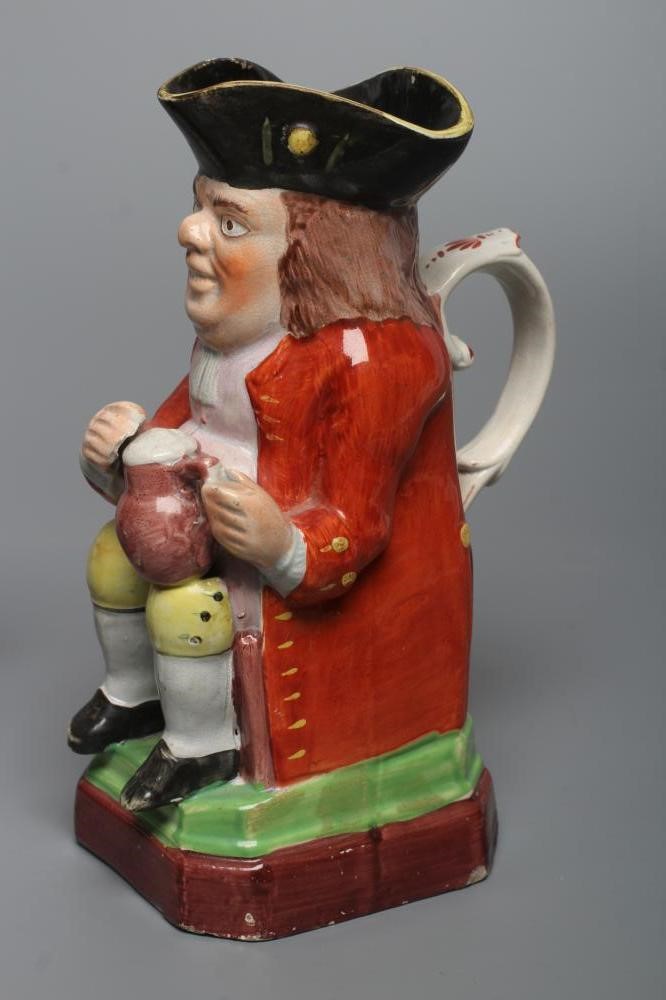 A PEARLWARE SMALL TOBY JUG Image