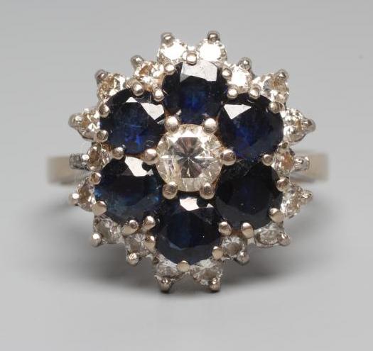 A SAPPHIRE AND DIAMOND CLUSTER RING Image