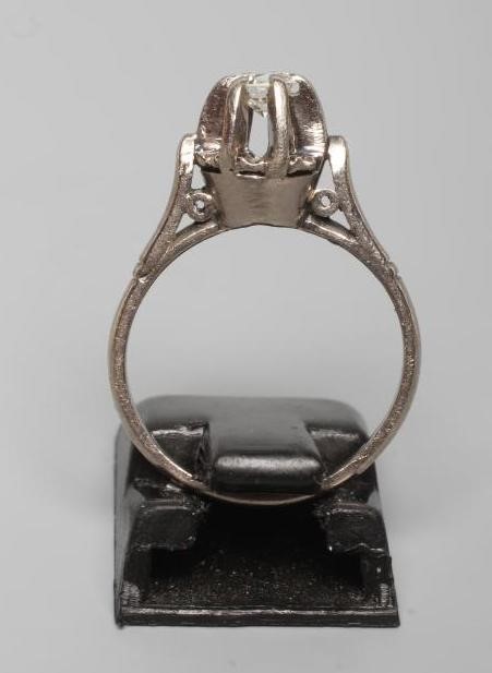 A SOLITAIRE DIAMOND RING, the brilliant cut stone of approximately 0.25cts in a high claw setting to Image