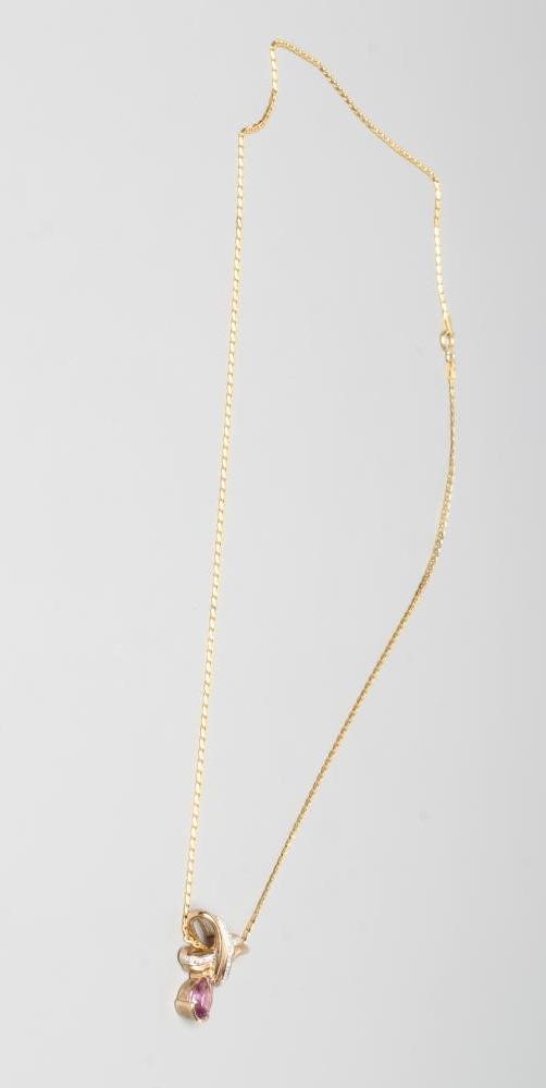 AN AMETHYST AND DIAMOND PENDANT Image