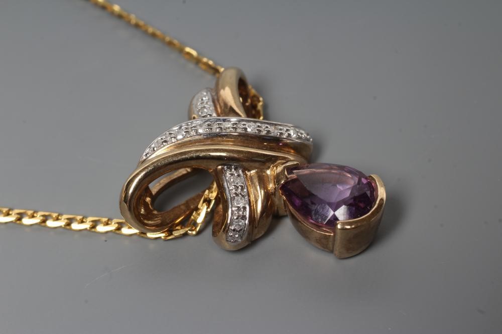 AN AMETHYST AND DIAMOND PENDANT Image