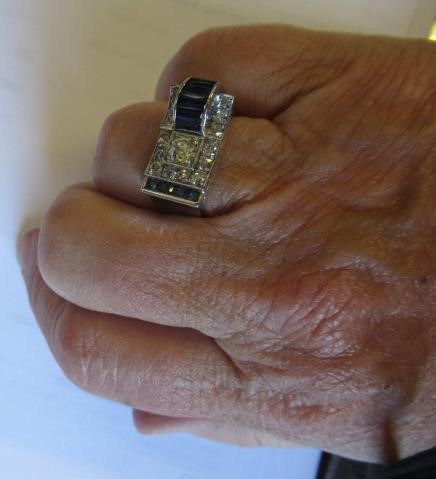 A PINK CHALCEDONY PENDANT, the shaped polished stone collet set in 9ct gold with a diamond point Image