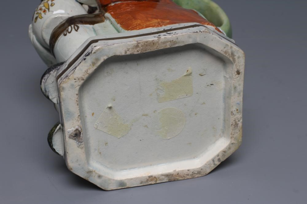 A PEARLWARE "WARTY FACE" TOBY JUG Image