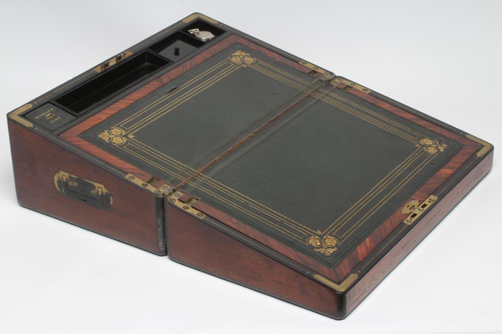 A VICTORIAN MAHOGANY AND BRASS BOUND LAP DESK Image