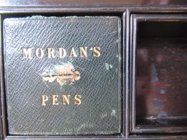 A VICTORIAN MAHOGANY AND BRASS BOUND LAP DESK Image