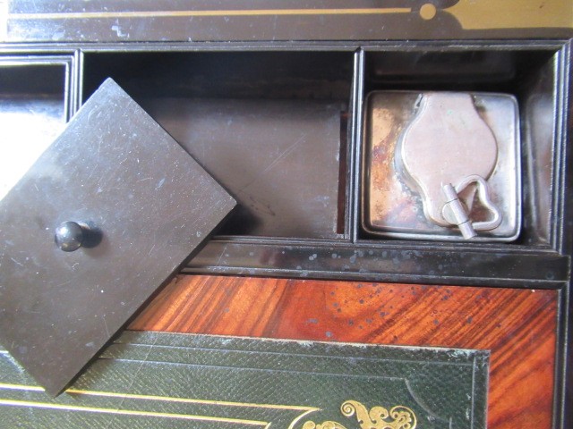 A VICTORIAN MAHOGANY AND BRASS BOUND LAP DESK Image