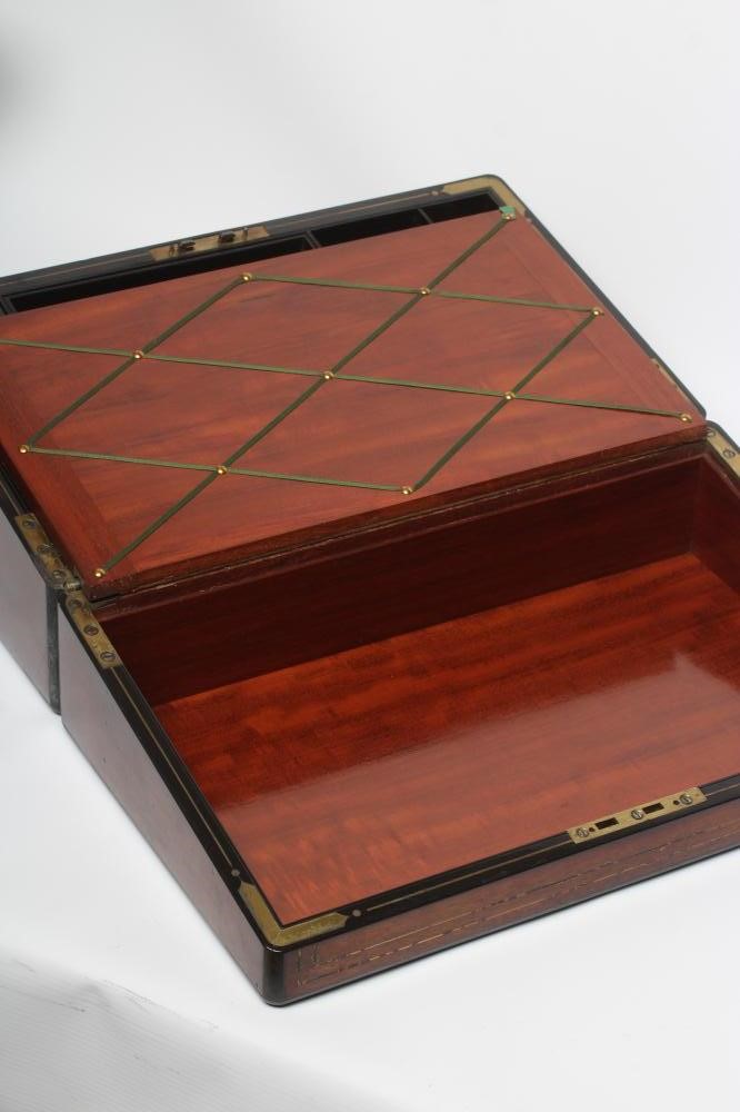 A VICTORIAN MAHOGANY AND BRASS BOUND LAP DESK Image