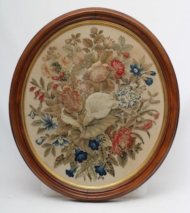A MID VICTORIAN OVAL WOOLWORK PICTURE worked in coloured wools in full cross stitch with flowers Image