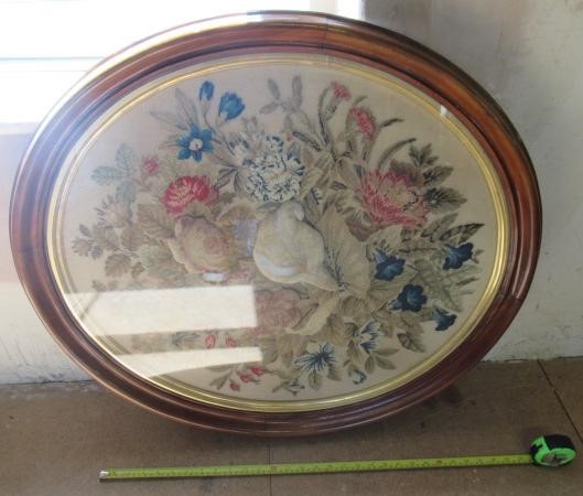 A MID VICTORIAN OVAL WOOLWORK PICTURE worked in coloured wools in full cross stitch with flowers Image