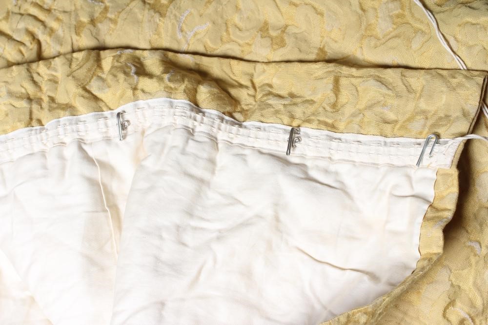 A PAIR OF GOLD RAISED DAMASK CURTAINS, modern, each lined and approximately 74" drop, 100" wide Image