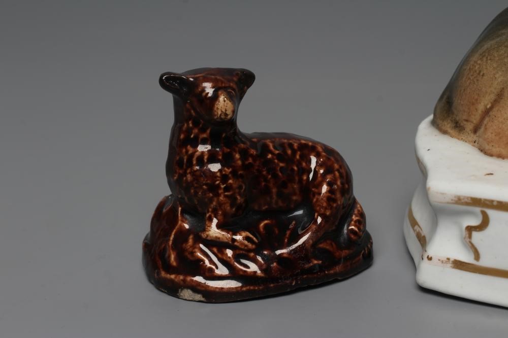 A STAFFORDSHIRE PORCELANEOUS LION Image