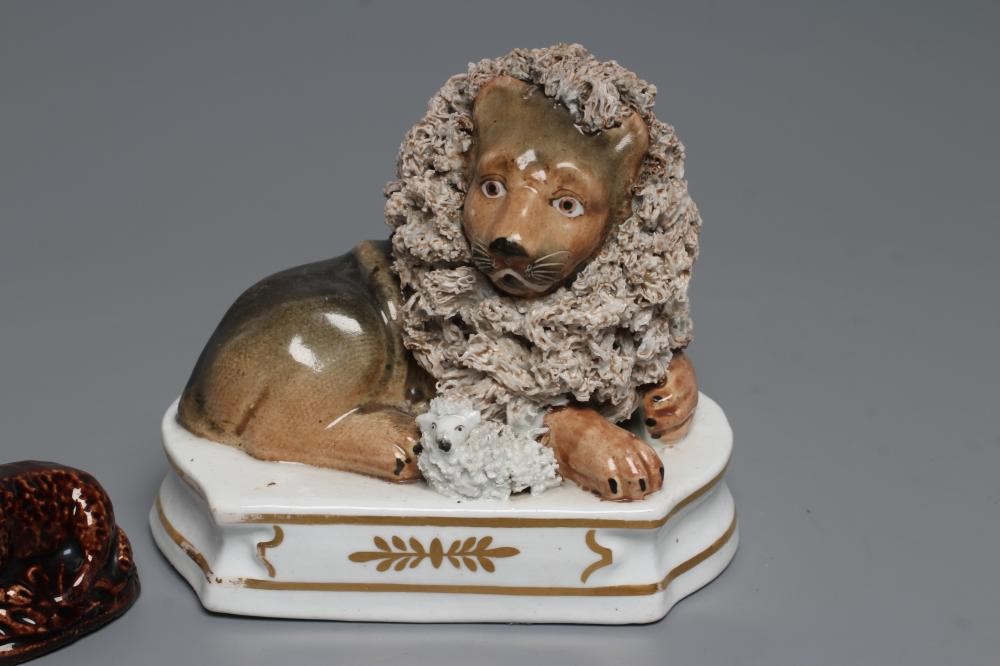 A STAFFORDSHIRE PORCELANEOUS LION Image