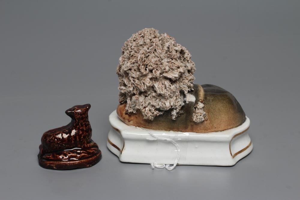 A STAFFORDSHIRE PORCELANEOUS LION Image