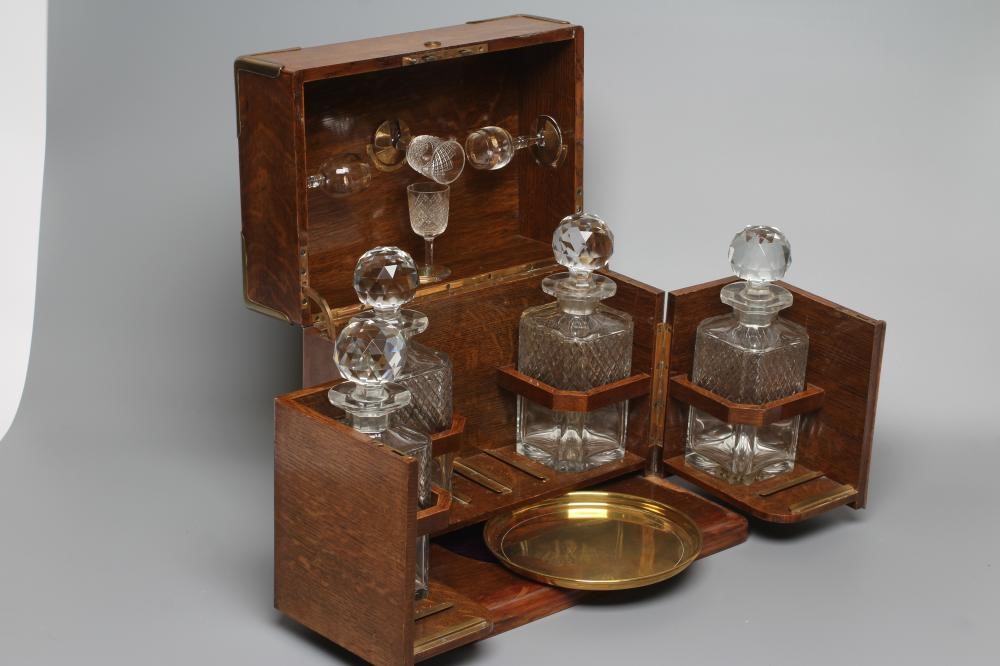 A VICTORIAN OAK AND BRASS BOUND TRAVELLING DRINKS CABINET Image