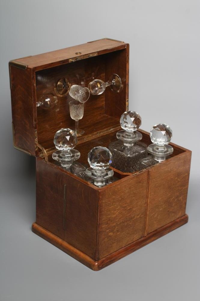 A VICTORIAN OAK AND BRASS BOUND TRAVELLING DRINKS CABINET Image