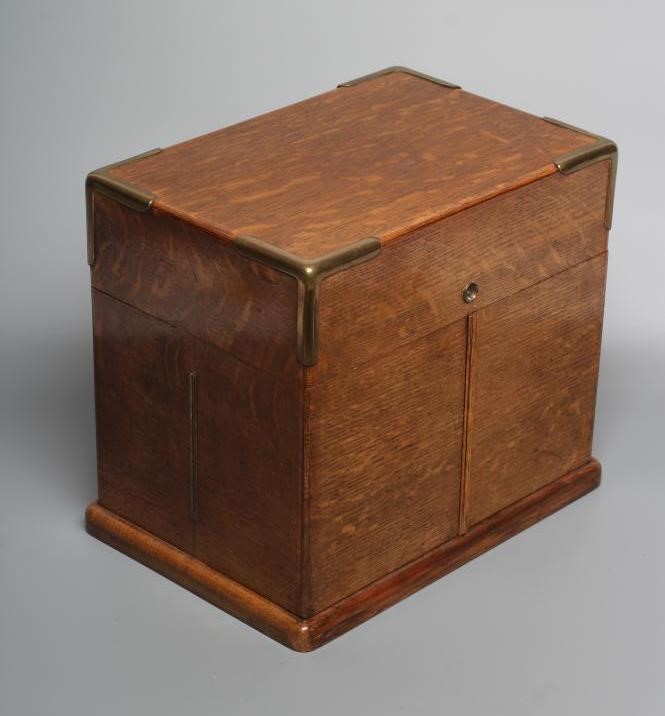 A VICTORIAN OAK AND BRASS BOUND TRAVELLING DRINKS CABINET Image