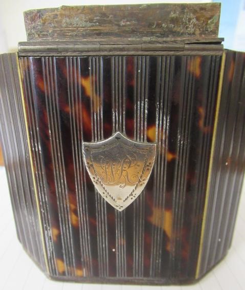 A GEORGE III SMALL TORTOISESHELL TEA CADDY Image