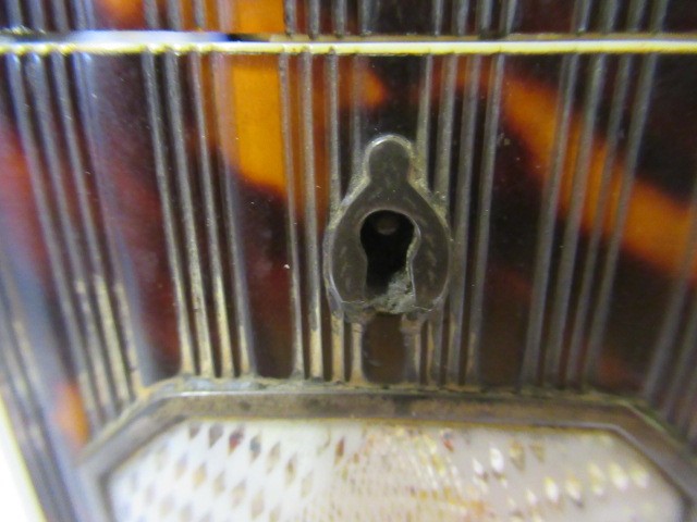 A GEORGE III SMALL TORTOISESHELL TEA CADDY Image