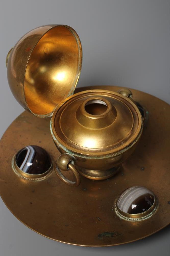 A VICTORIAN BRASS INKWELL of dished circular form Image