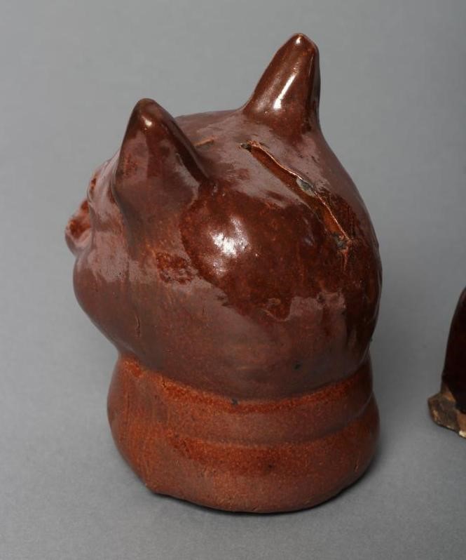 AN ENGLISH TREACLE GLAZED STONEWARE CAT Image