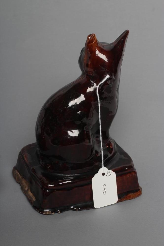AN ENGLISH TREACLE GLAZED STONEWARE CAT Image