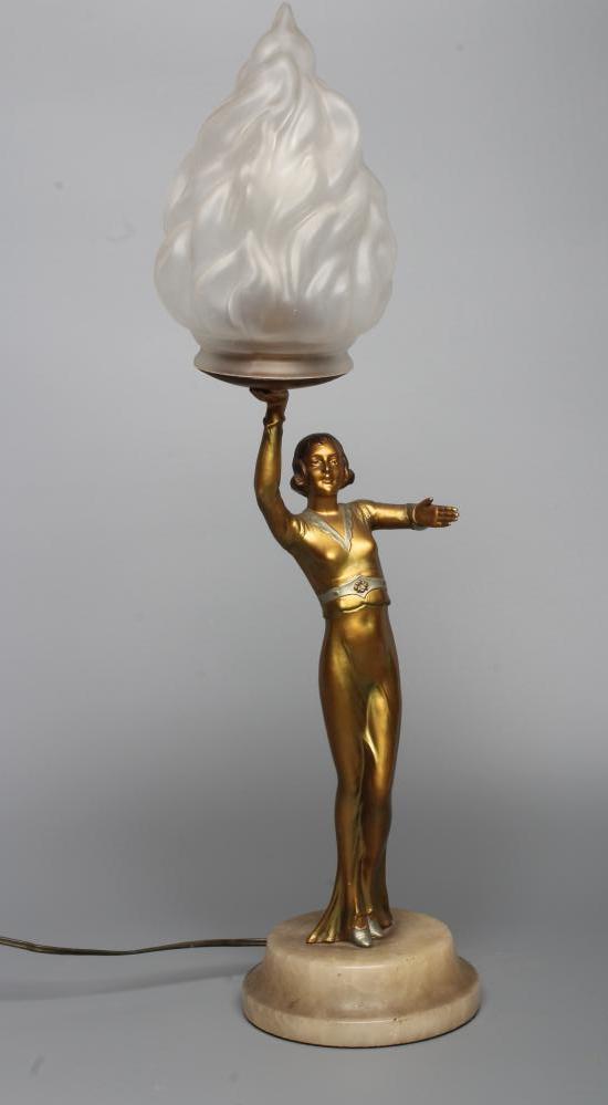 An art deco bronzed spelter figural electric lamp base modelled as a