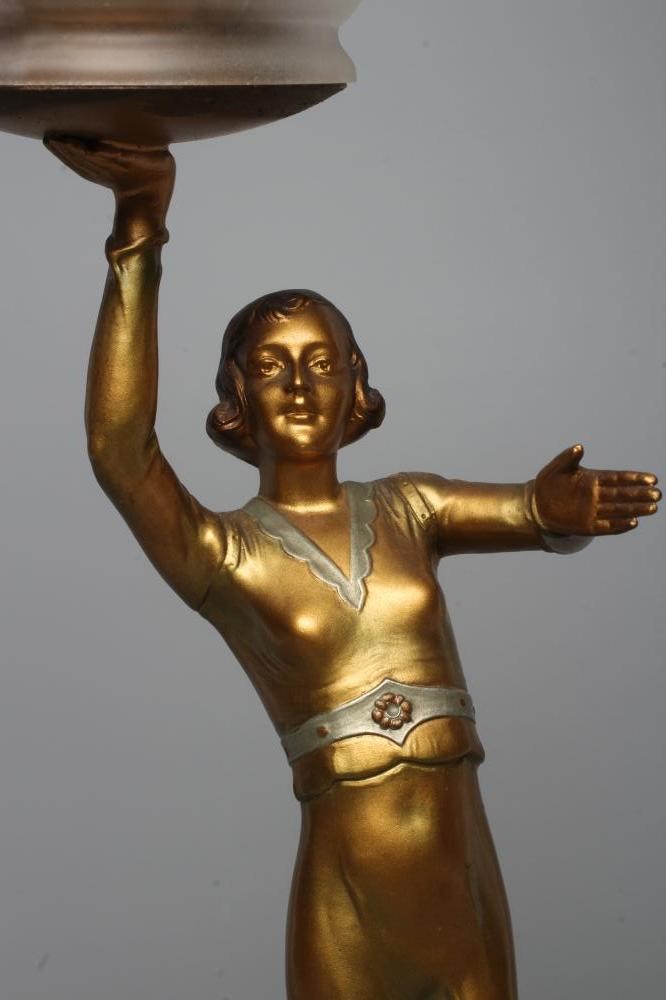 AN ART DECO BRONZED SPELTER FIGURAL ELECTRIC LAMP BASE modelled as a young lady with shingled hair Image