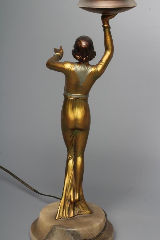 AN ART DECO BRONZED SPELTER FIGURAL ELECTRIC LAMP BASE modelled as a young lady with shingled hair Image