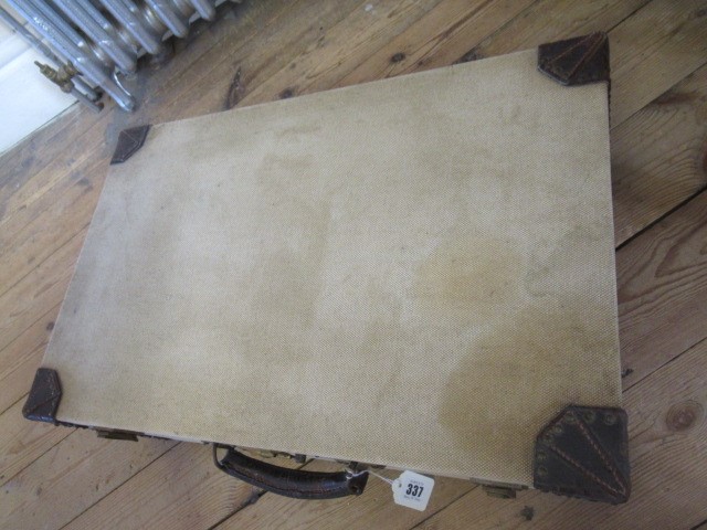 AN HERMES CANVAS AND LEATHER SUITCASE Image