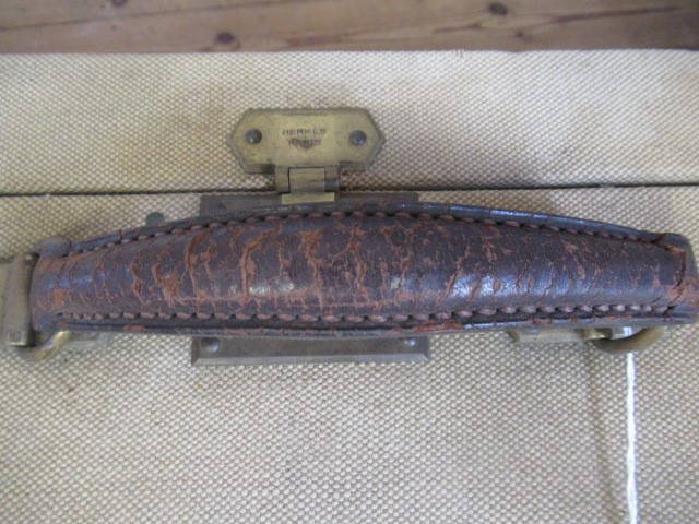 AN HERMES CANVAS AND LEATHER SUITCASE Image