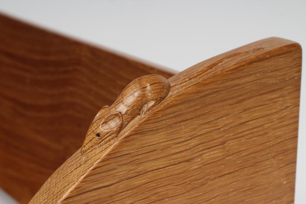 A ROBERT THOMPSON ADZED OAK BOOK TROUGH, the quadrant ends carved with mouse trademark in high Image