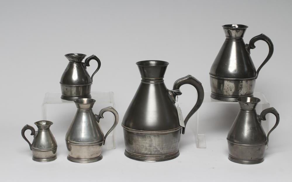 A SET OF SIX PEWTER HAYSTACK MEASURES, c.1900, stamped Austin & Son, Cork, ranging from a quart to Image
